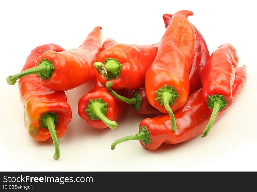 Red chili peppers on white