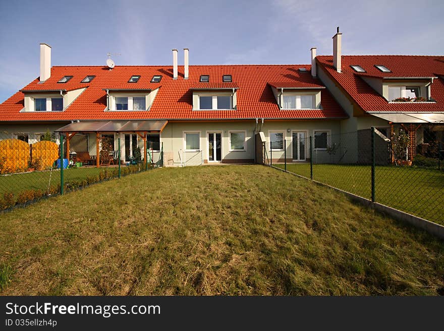 Row house in the middle with garden lawn. Row house in the middle with garden lawn