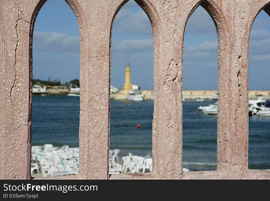 Egypt. Alexandria. View from the Bridge over the Mediterranean Sea, a lighthouse, beach and yacht. Egypt. Alexandria. View from the Bridge over the Mediterranean Sea, a lighthouse, beach and yacht.