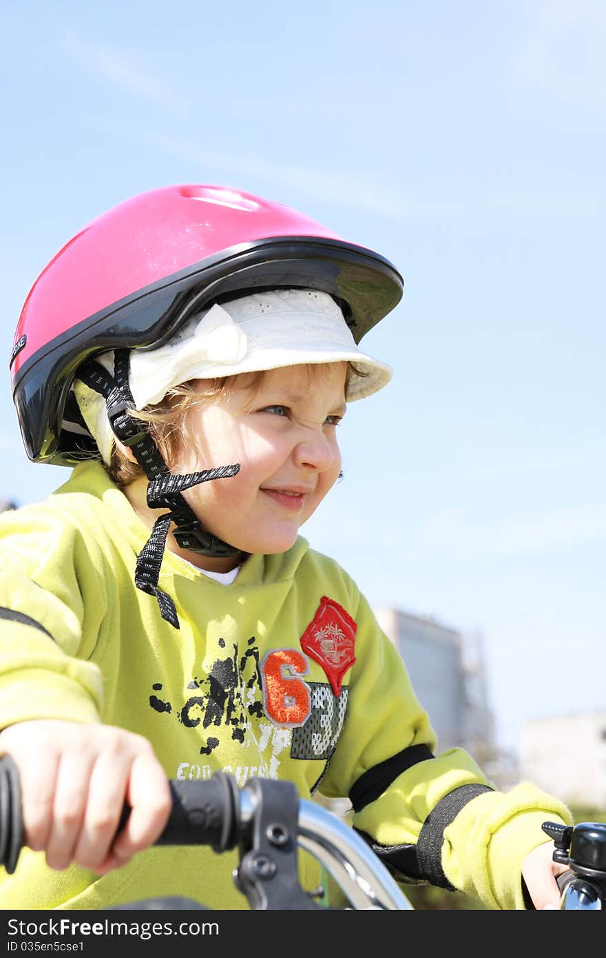 Portrait of a girl in a red helmet. Portrait of a girl in a red helmet