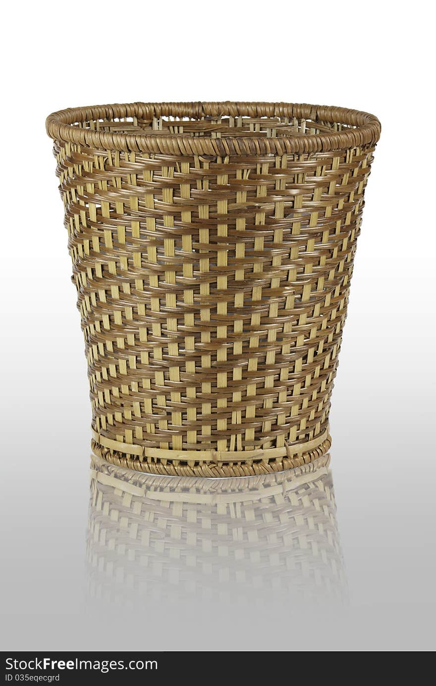 Handmade rattan bin on white background