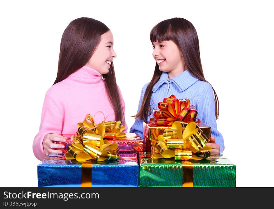 Two little girls with a gift boxes. isolated on white. Two little girls with a gift boxes. isolated on white