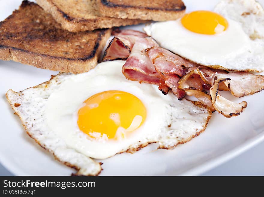 Breakfast - toasts, eggs, bacon