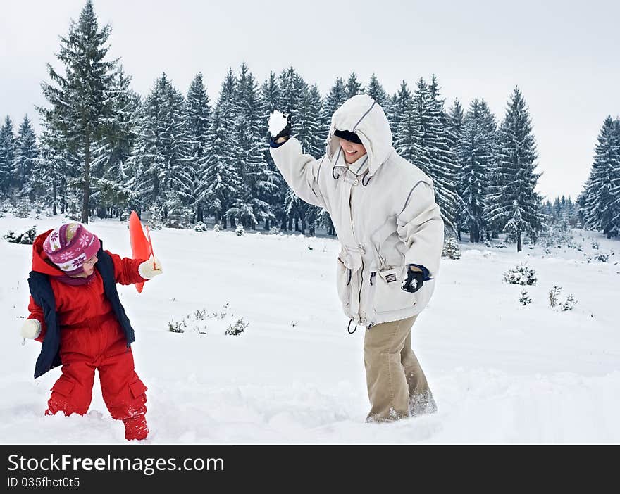 Happy woman playing with her daughter