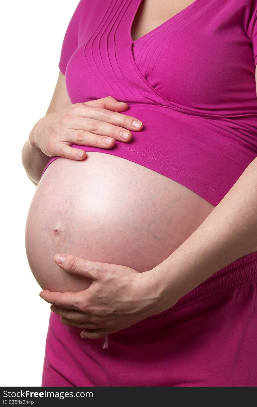 Pregnant woman profile with hands on the stomach over white background. Pregnant woman profile with hands on the stomach over white background