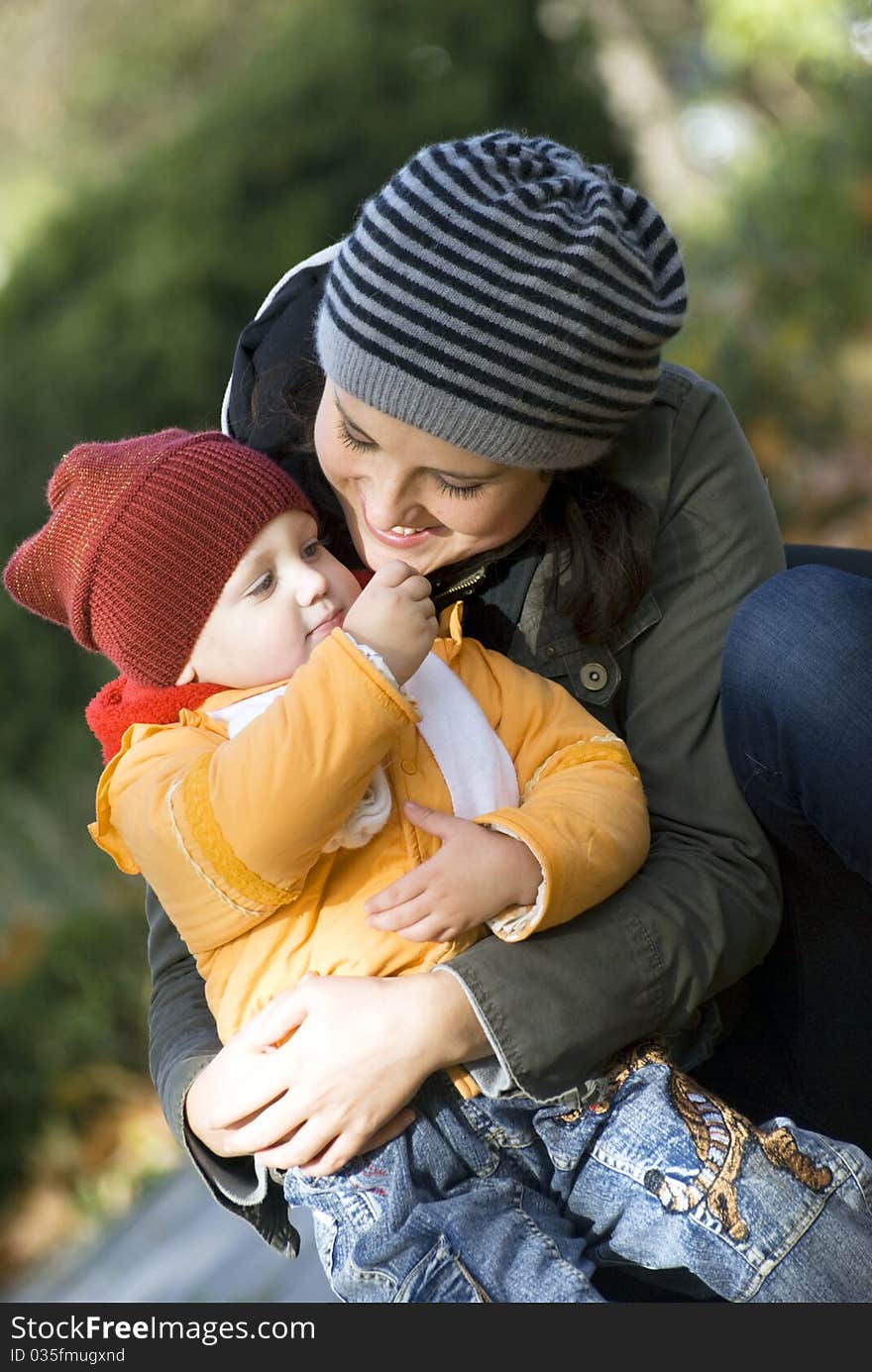 mother and daughter playing outdoors. mother and daughter playing outdoors