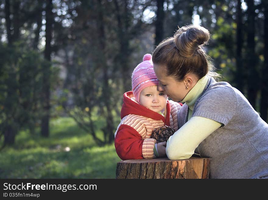 mother and daughter playing outdoors. mother and daughter playing outdoors