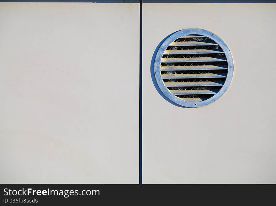 Architectural details: ventilation lattice on wall of building