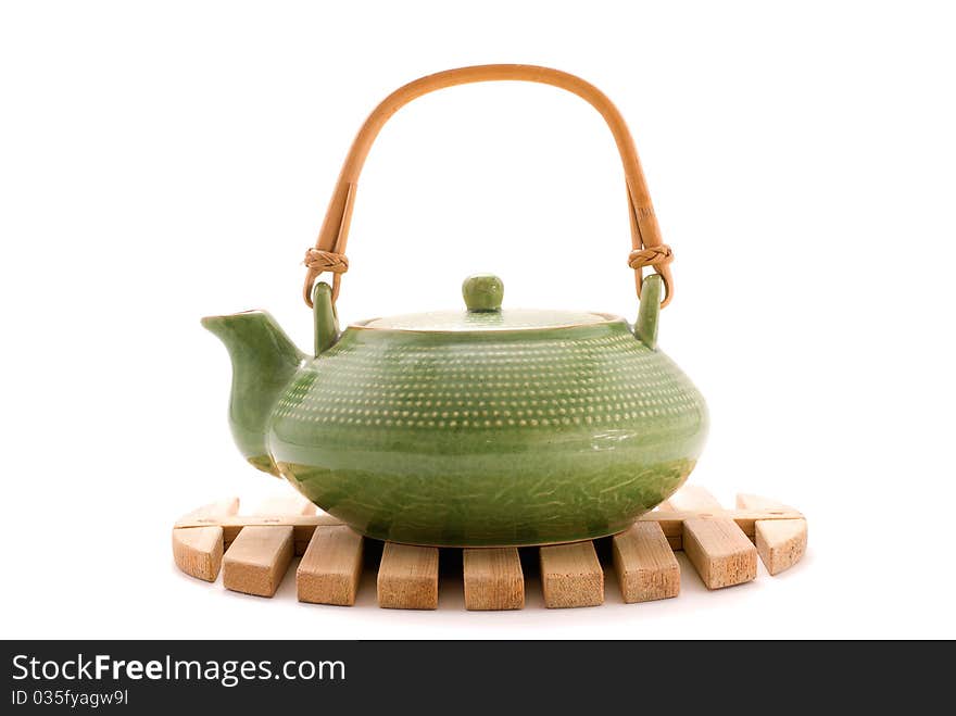 Green teapot on stand