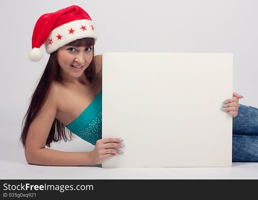 Smiling young woman on grey background