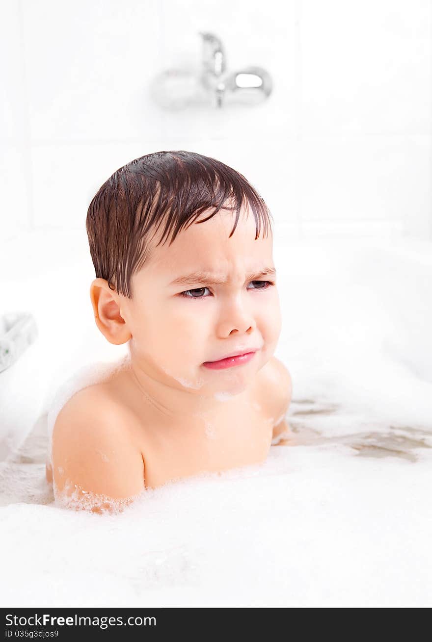 Displeased Boy Taking A Bath