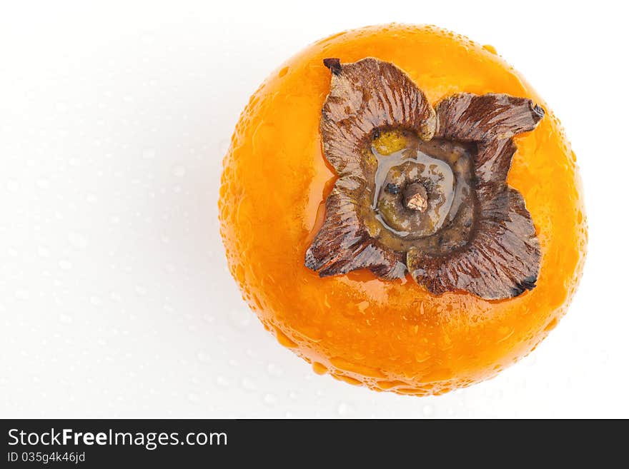 Persimmon fruit with drops of water