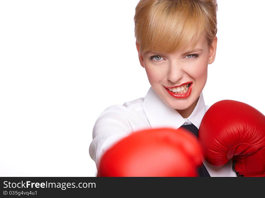 Portrait of beautiful and young business woman wearing boxing gloves. Portrait of beautiful and young business woman wearing boxing gloves