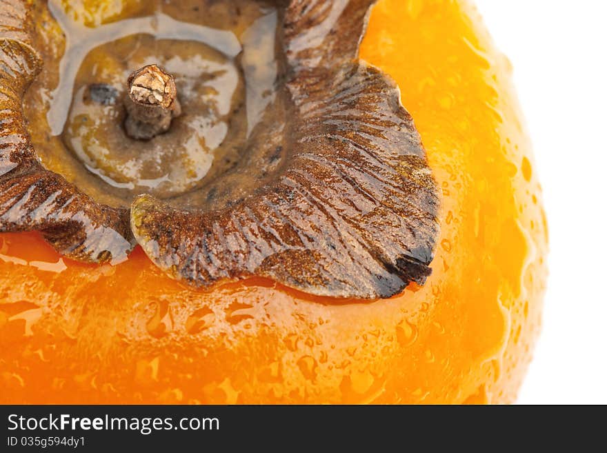 Persimmon fruit with drops of water