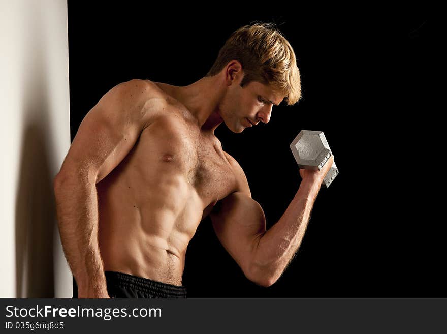 Young Man Lifting Weights