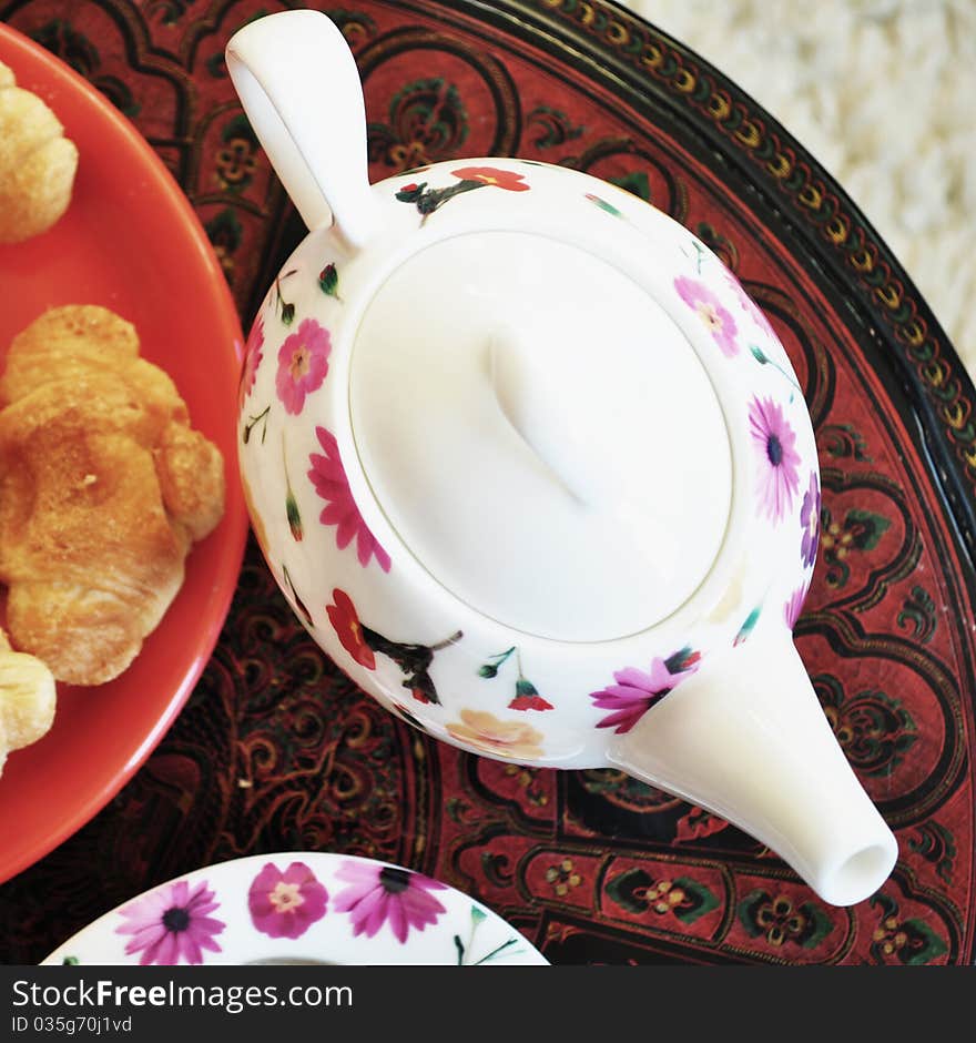 Flower teapot at breakfast table. Flower teapot at breakfast table