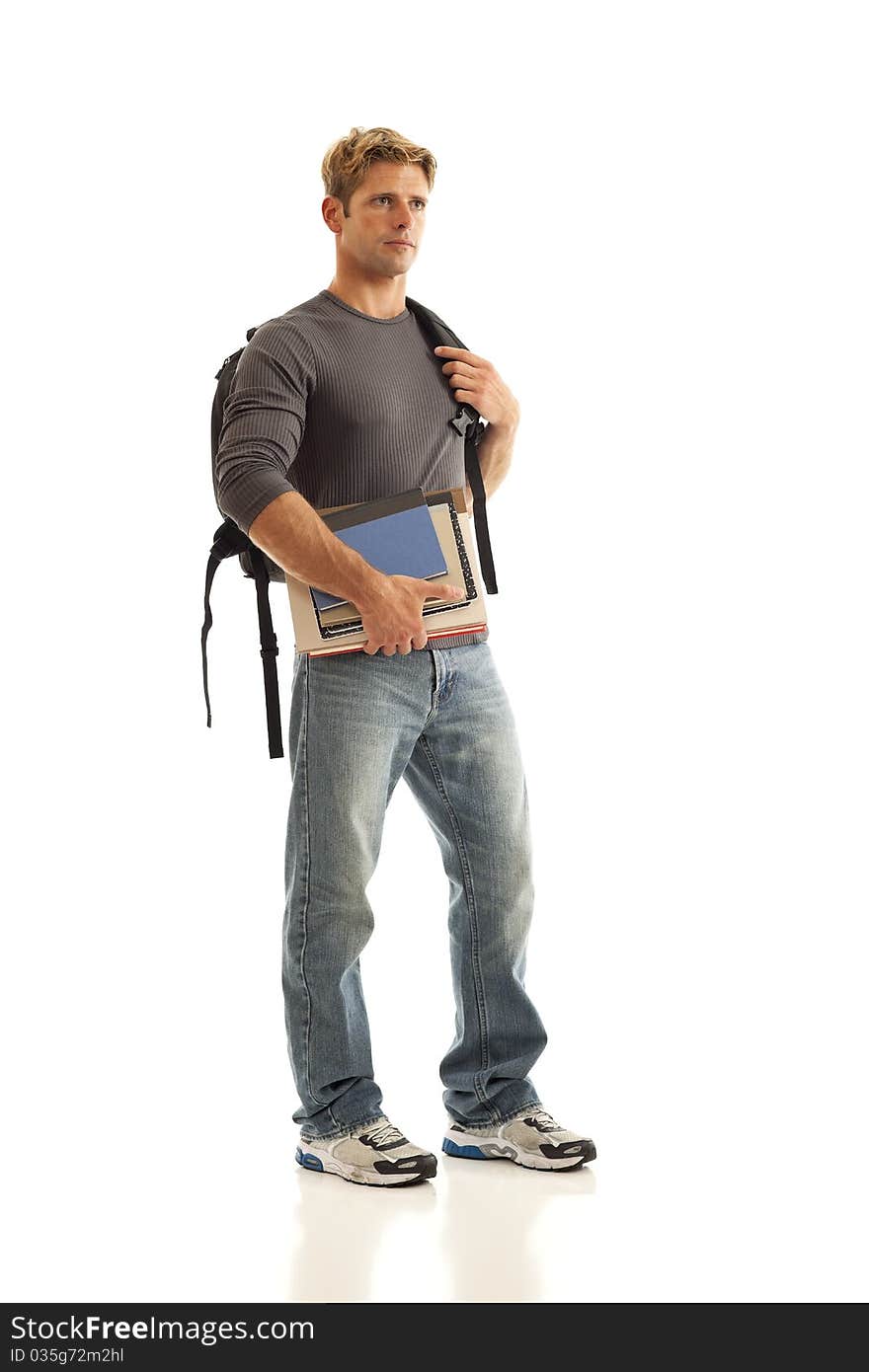 Young male student with books and backpack. Young male student with books and backpack