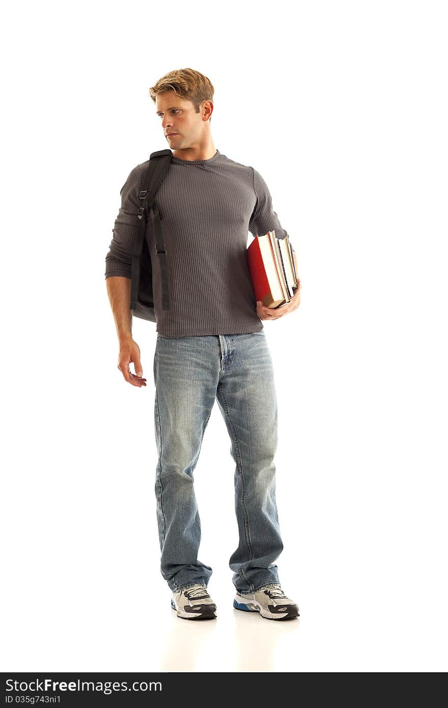 Young man with books and backpack