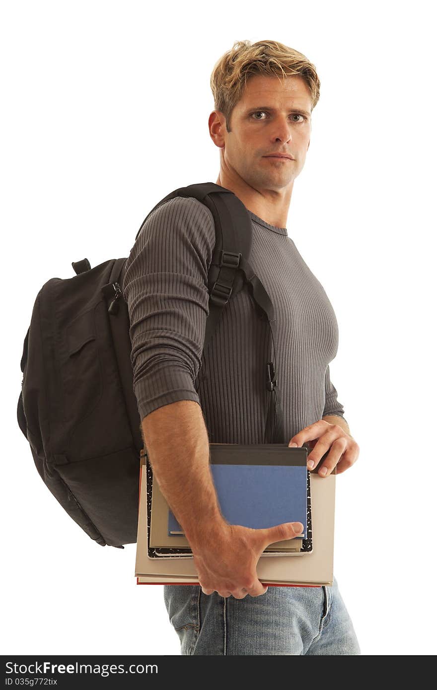 Young man with books and backpack