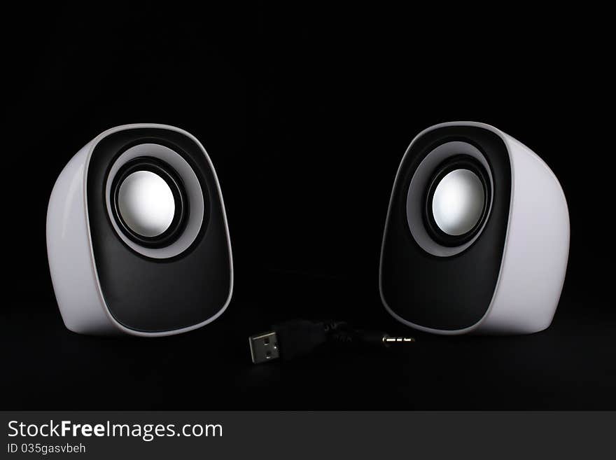 Speaker white on a black background. Speaker white on a black background.