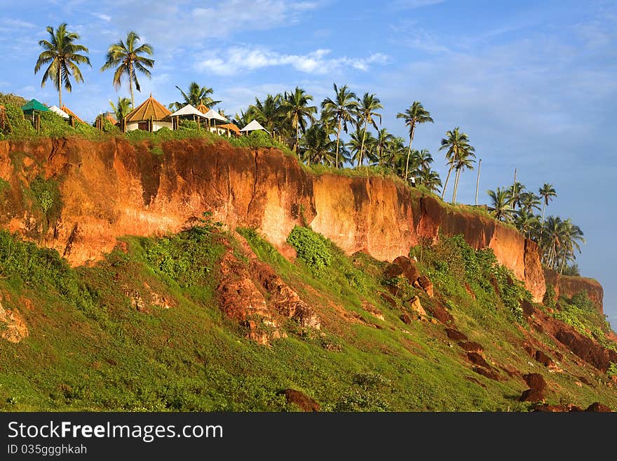 Tropical Huts On A Clifftop