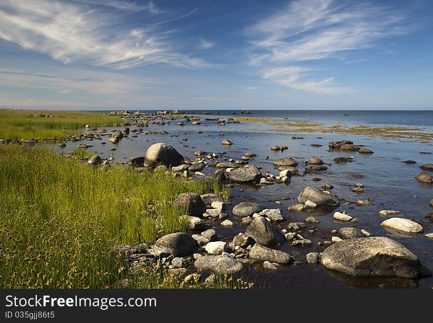 A stony shore at Ypnasted.between Svaneke and Gudhjem. Bornholm. Denmark. A stony shore at Ypnasted.between Svaneke and Gudhjem. Bornholm. Denmark.