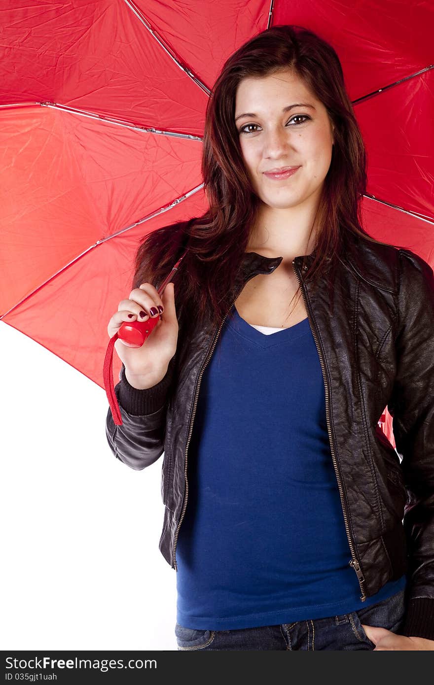 A woman is holding a red umbrella while smiling. A woman is holding a red umbrella while smiling.