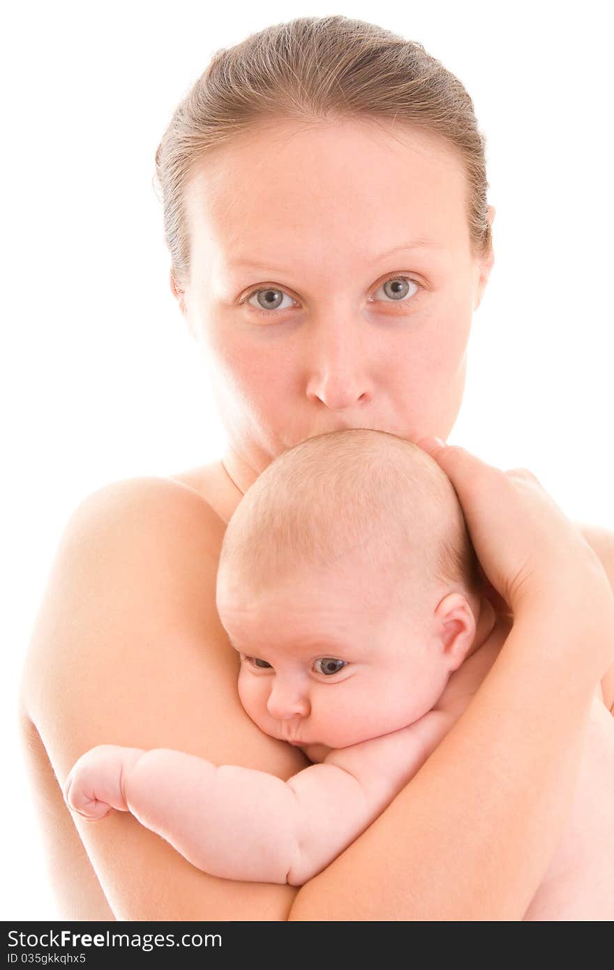 Mother cuddles her baby to her breast. Mother cuddles her baby to her breast.