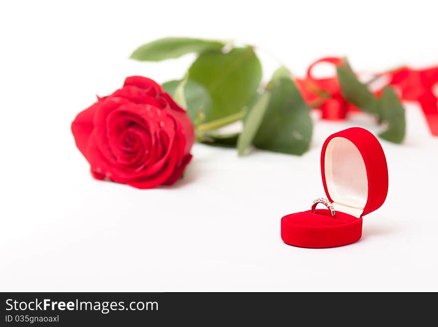 Flower of rose and ring on a white background