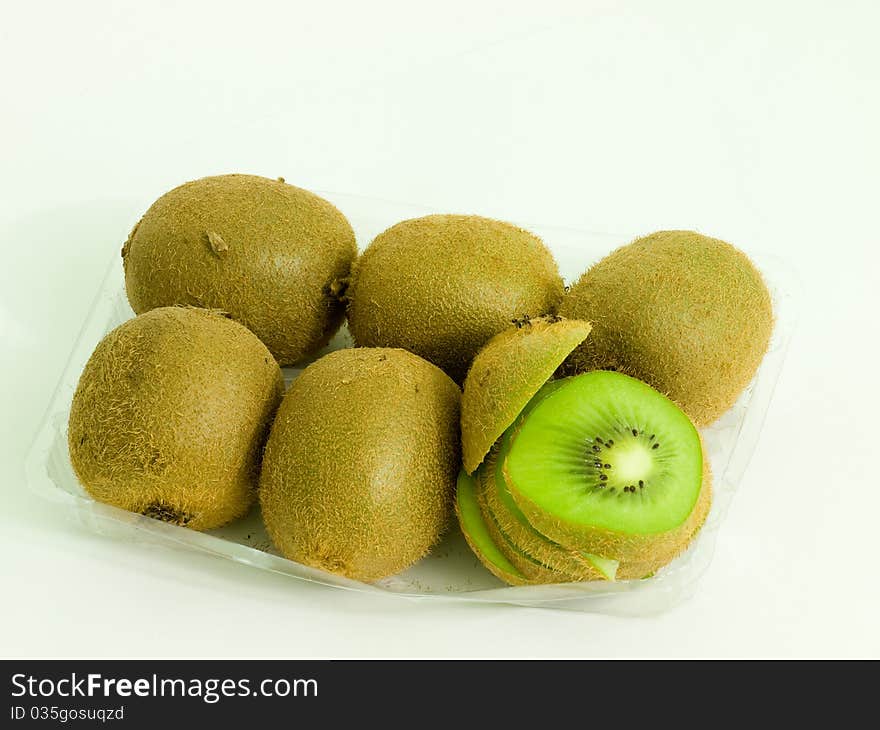 sliced Kiwi fruit in plastic tray