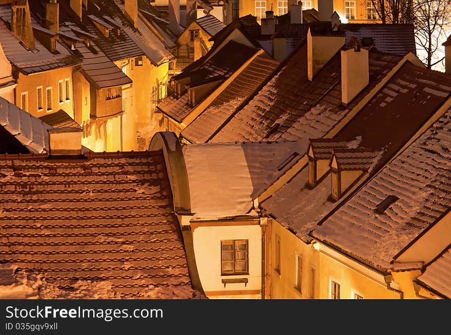 Historic houses in Cesky Krumlov during the nighttime.