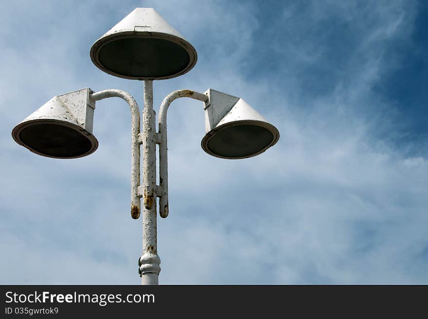 Three Loudspeaker against the blue sky with clouds