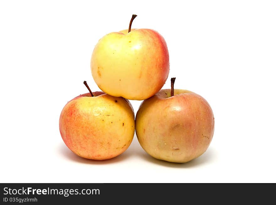 Ripe juicy apples on a white background