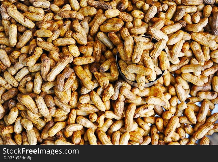 Boiled Peanuts with a cup of peanuts