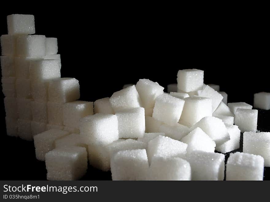 A pile of sugar cubes in a mess. A pile of sugar cubes in a mess