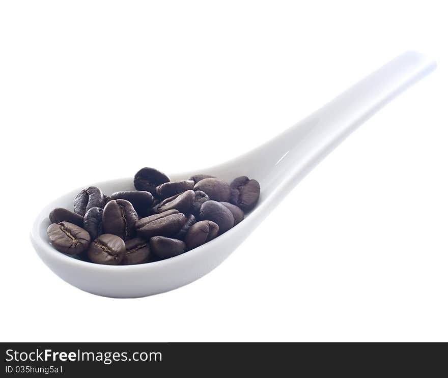 Coffee on white ceramic spoon