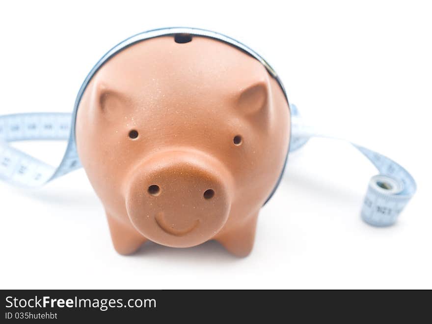 Brown piggy bank isolated on white