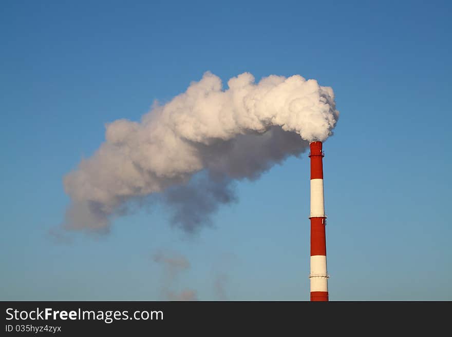 Smoke Pipe on a sky background. Smoke Pipe on a sky background