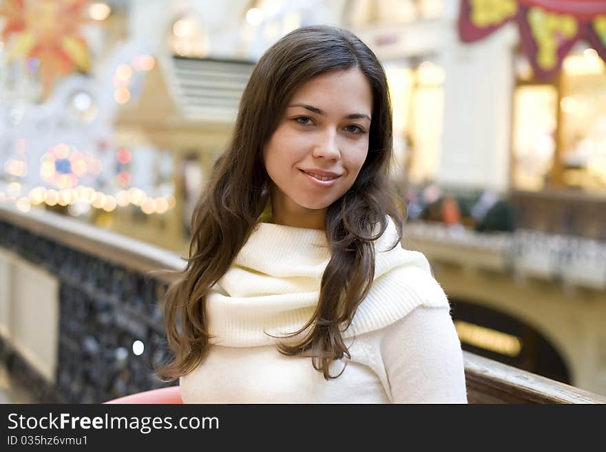 The young happy woman the brunette in a white dres