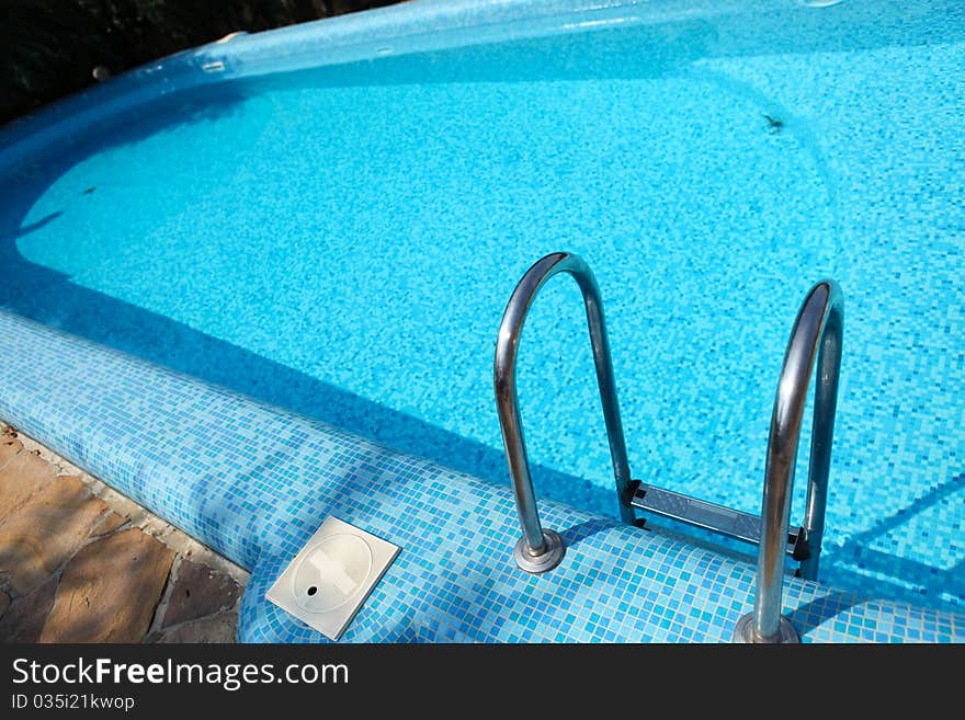 Picture of swimming pool with blue water. Picture of swimming pool with blue water