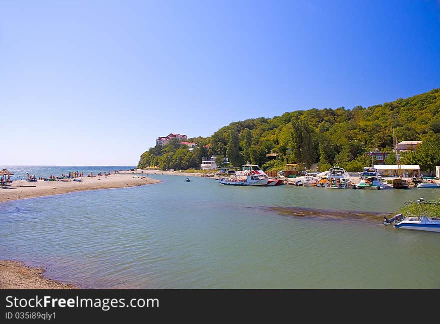 View of  bay of  Black Sea, beach and boat station, Russia.