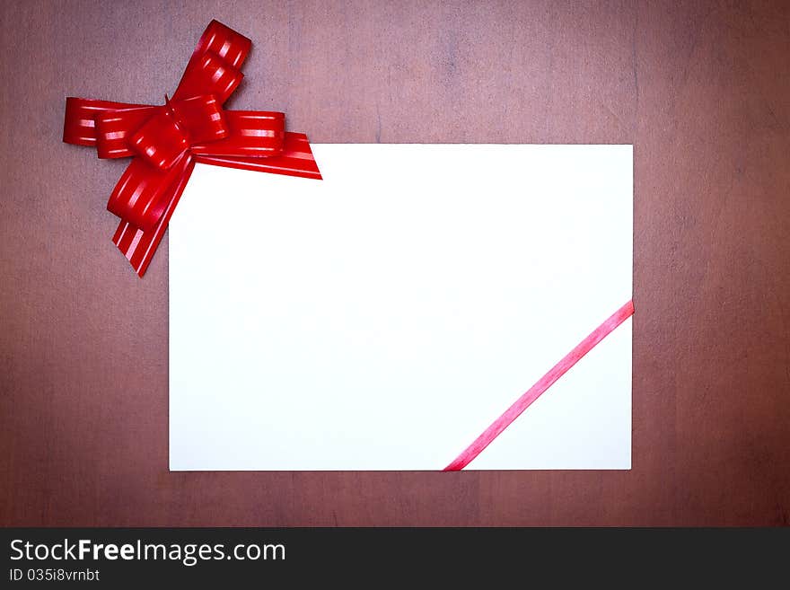 Red bow with paper card