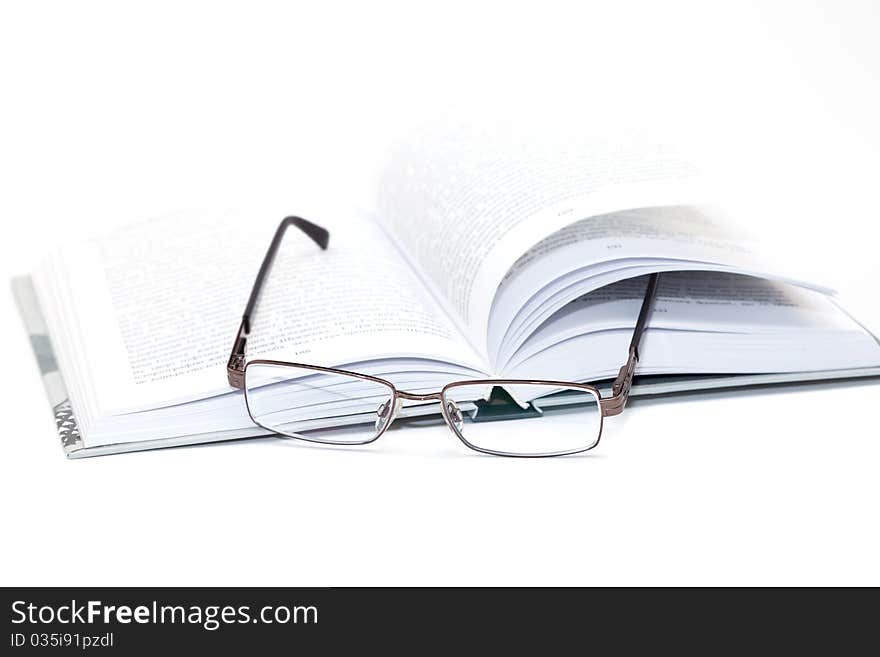 Glasses On An Open Book