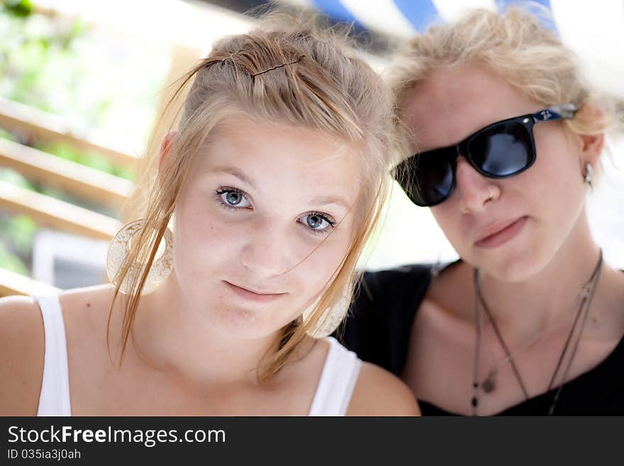 Boy and girl teens looking into camera with a friendly smile. Boy and girl teens looking into camera with a friendly smile