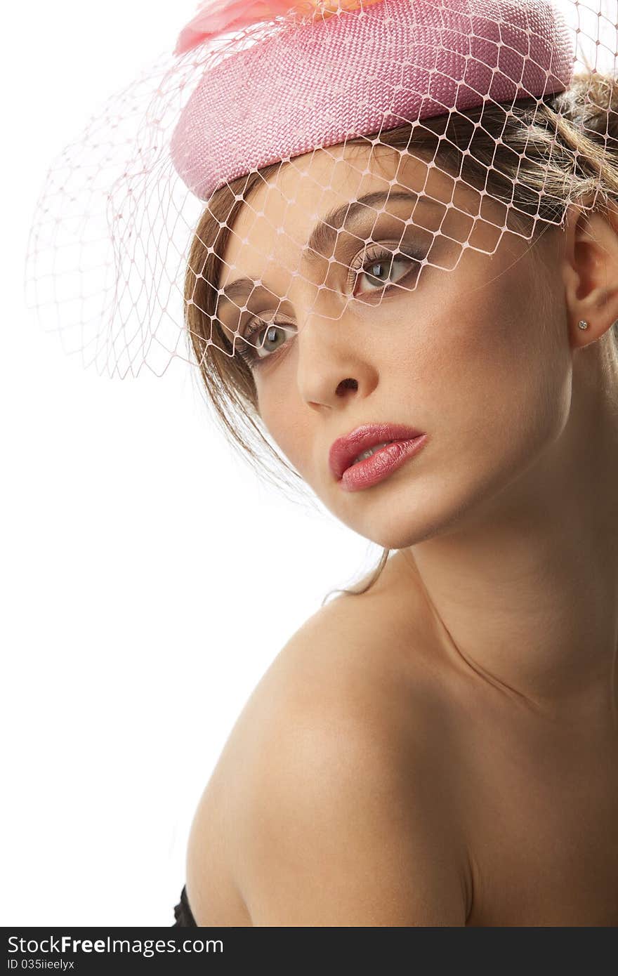 Portrait of pretty young woman in pink bonnet with voile. Vintage Make-up