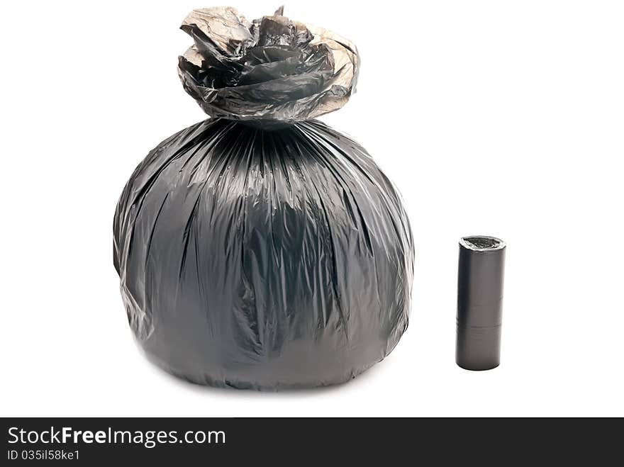 One black garbage bag isolated on white