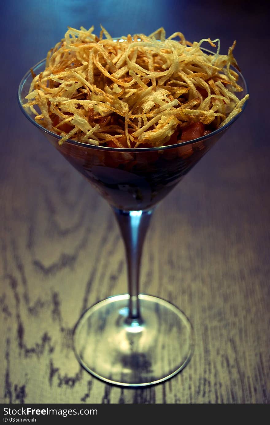 Salad with crunchy potato in glass. Salad with crunchy potato in glass