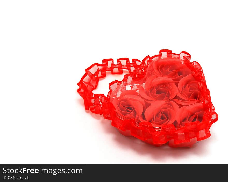 Red Roses in Heart-Shaped Box on White Background. Red Roses in Heart-Shaped Box on White Background