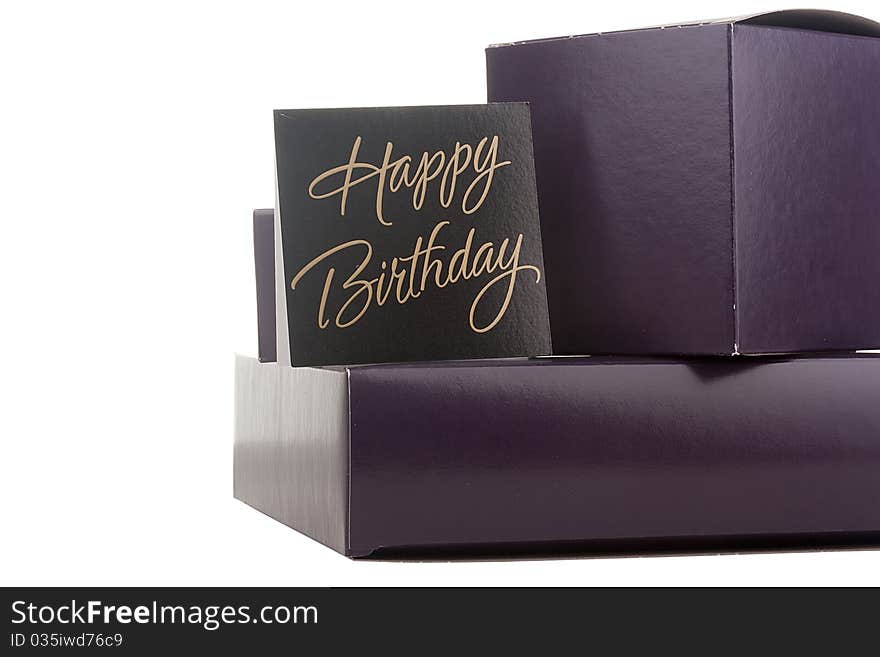 Gift box of darkly violet colour with a congratulatory card.