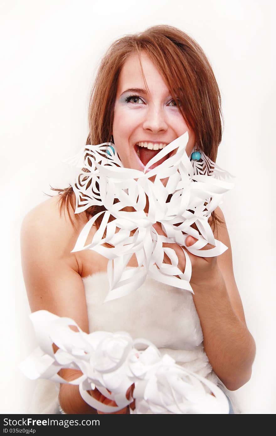 Young girl with cut snowflakes